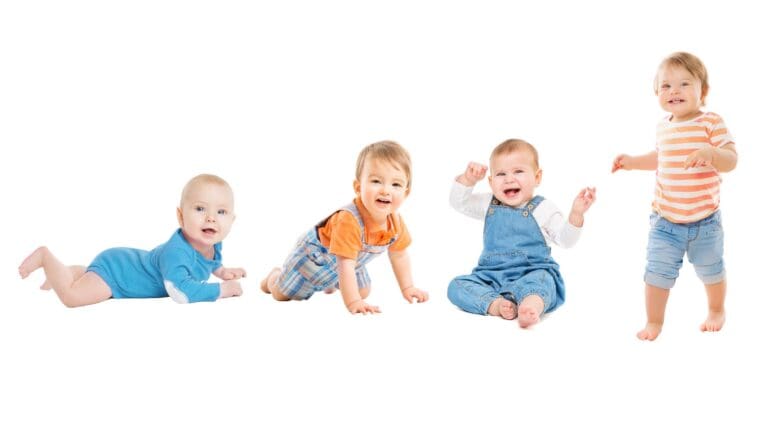 4 babies in front of a white background one on its stomach one crawling one sitting one standing