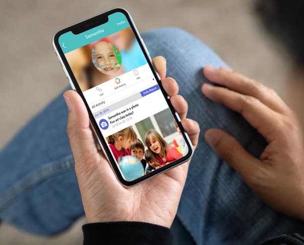 Parent Checking Preschool App On Phone