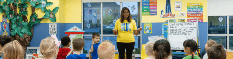 teacher speaking to preschool students all standing up