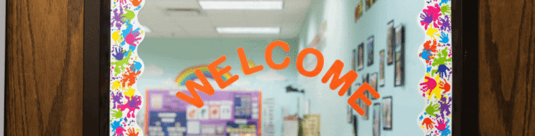 orange welcome sign on a classroom door