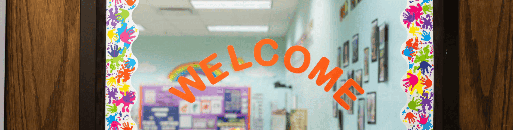 orange welcome sign on a classroom door