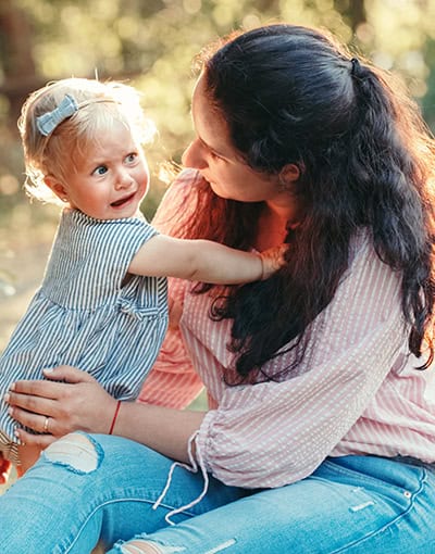 Mother Holding Toddler Outdoors