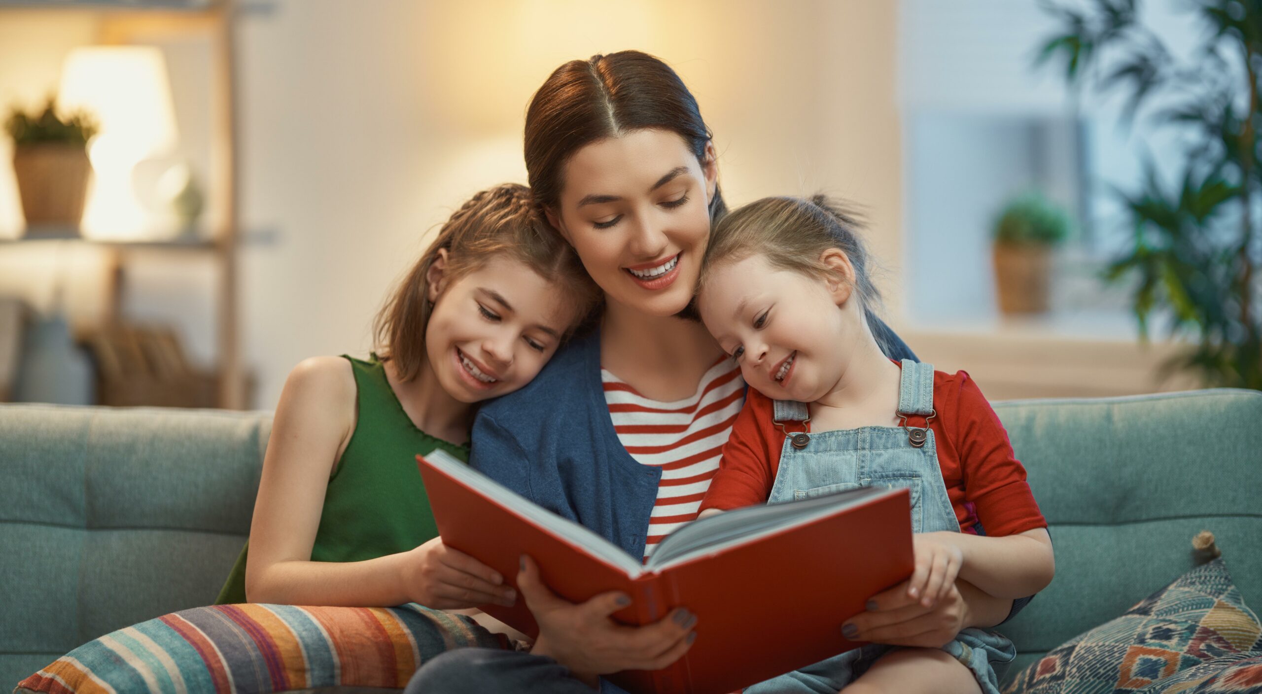 Mother And Children Enjoy Benefits Of Reading